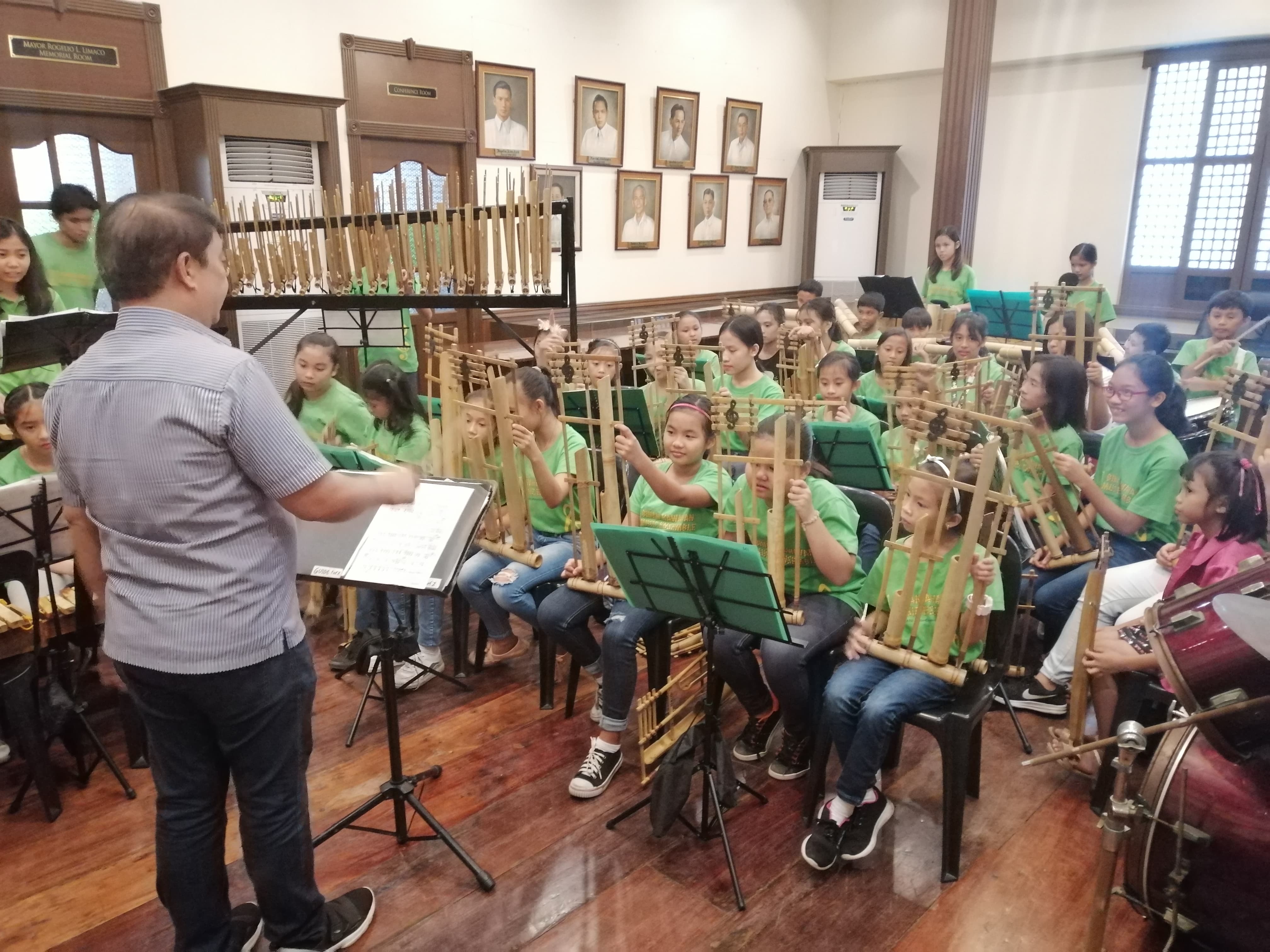 Apart from being the conductor and musical director of Musikawayan, Ramos also trains members of the Binan Kawayan Music Ensemble Apart from being the conductor and musical director of Musikawayan, Ramos also trains members of the Binan Kawayan Music Ensemble